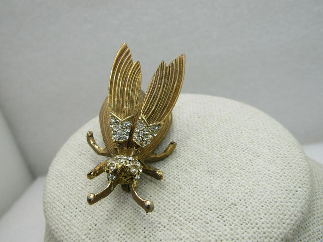 Vintage Rhinestone Fly Trembler Brooch, Unsigned Hattie: Vintage Rhinestone Fly Trembler Brooch, Unsigned Hattie Carnegie, 2" tall and slightly over 1" wide at the widest point. The upper wings are mounted on springs and have movement when worn. The head nd