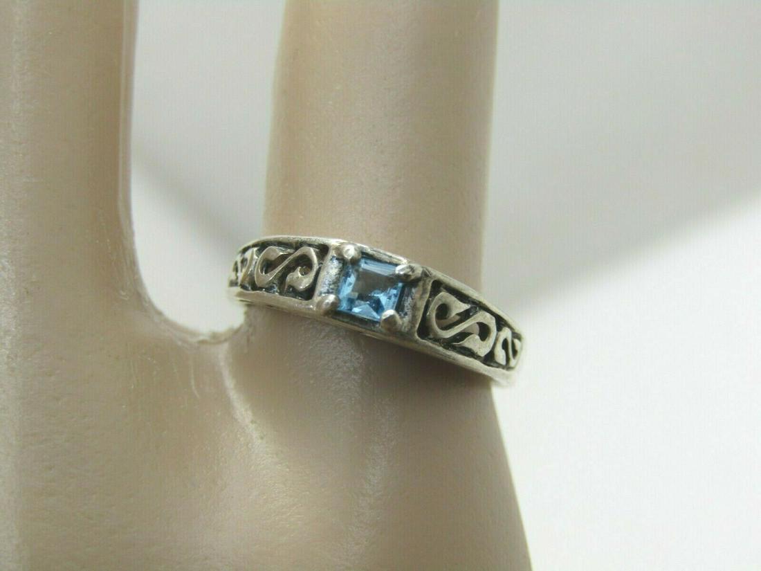 Vintage Sterling Scrolled Celtic Topaz Ring, Sz. 5: Vintage Sterling Scrolled Celtic Topaz Ring, Sz. 5, Weight is appx. 2.17gr. Scrolled design down the band and under the stone front and back. The scrolling has a Celtic look to it. The stone is appx. 