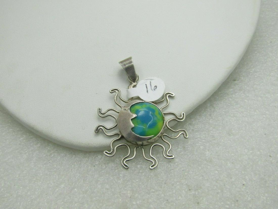 Vintage Sterling Silver Sun/Moon Pendant, Blue Yellow: Vintage Sterling Silver Sun/Moon Pendant, Blue Yellow World. The stone is man-made but looks like the glove in yellow and blue. This has a bezel-set stone with a crescent moon on the left of the stone