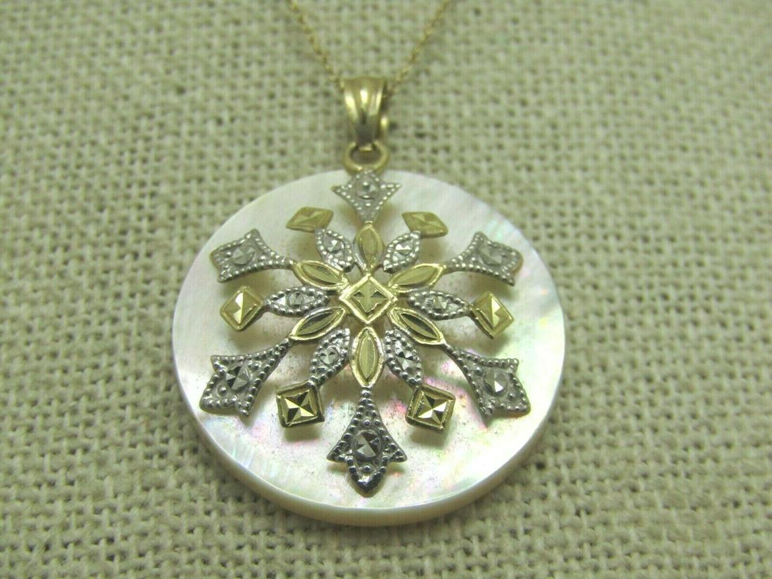 10KT Mother-of-Pear; l Filigree Necklace, Two-Tone,: 10kt Two-Tone Filigree MOP Necklace with domed snowflake design in yellow and white 10kt gold. Weight of the entire piece is appx. 4.11. grams - the chain and bail weight appx. .62 gr however that doe