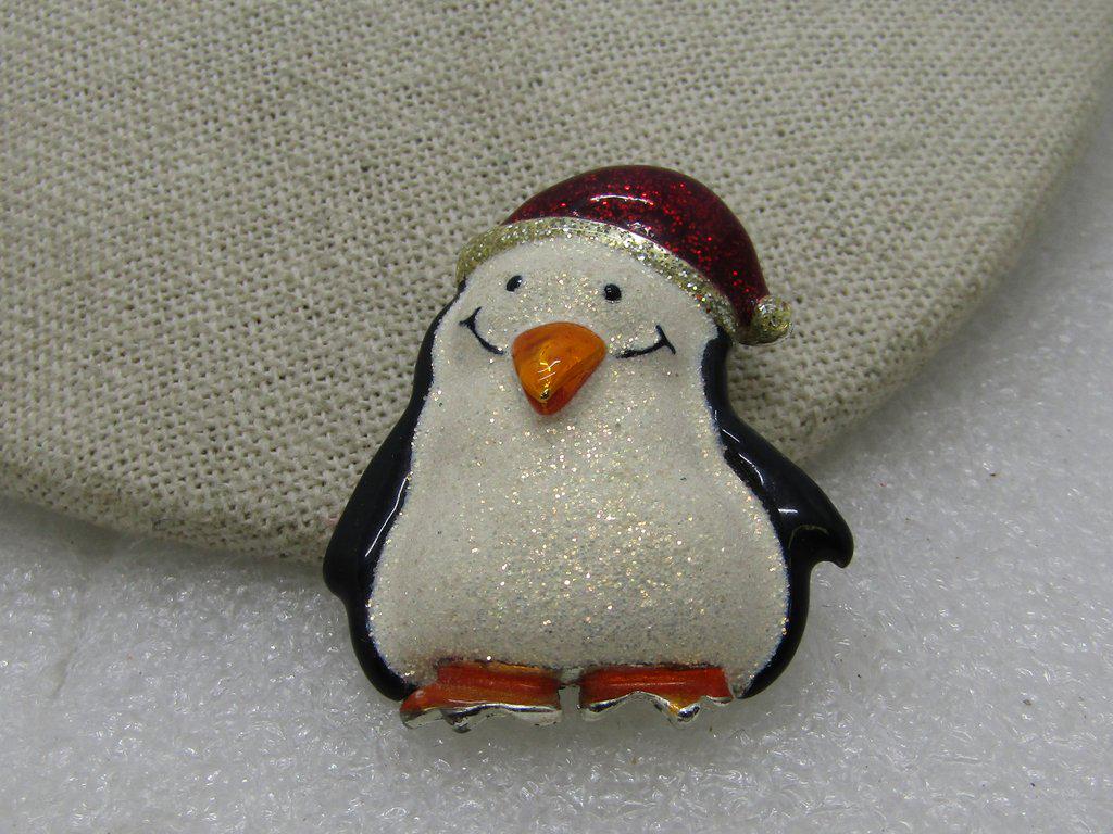 Vintage Danecraft Glitter Santa Penguin Brooch, 1-1/8",: Vintage Danecraft Santa Penguin Brooch, enameled and glittered in black, white, red, silver, orange. It is 1-7/8" tall and 1.25" wide. Puffy design, not a flat pin. Silver tone metal and signed Danecr