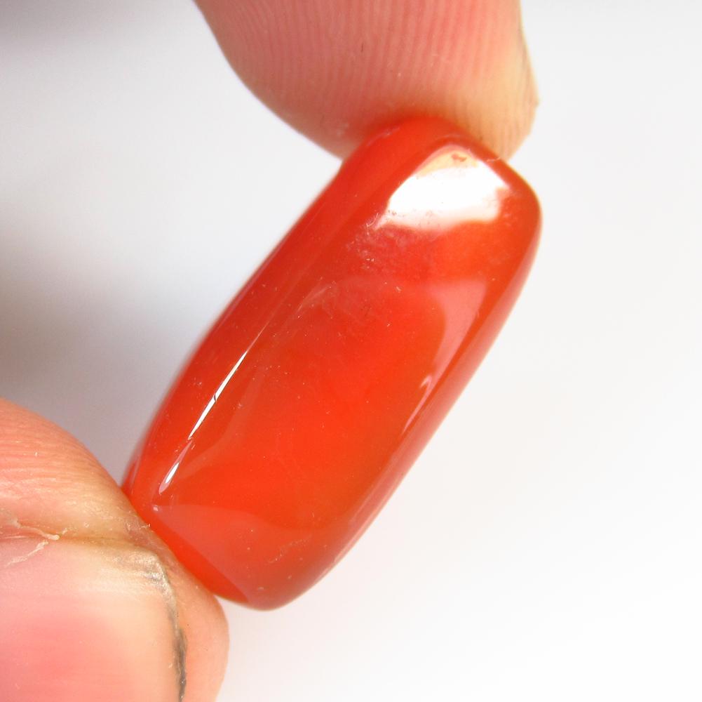 21.25 Ct Natural Drilled Carnelian Rectanguler Cab: No Reserve! Title: 21.25 Ct Natural Drilled Carnelian Rectanguler Cab Stone Clarity: Semi-Transparent Gemstones: Natural Carnelian Carat Weights: 21.25 Size/Dimensions: 27.00 x 10.40 x 9.80 mm Additio