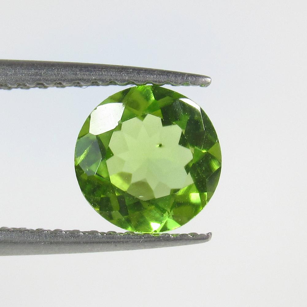 1.20 Ct Natural Pakistan Peridot Round Cut: No Reserve! Title: 1.20 Ct Natural Pakistan Peridot Round Cut Stone Clarity: VVS Gemstones: Natural Peridot Carat Weights: 1.2 Size/Dimensions: 7.00 x 7.00 x 3.90 mm Additional Information: Top Class 