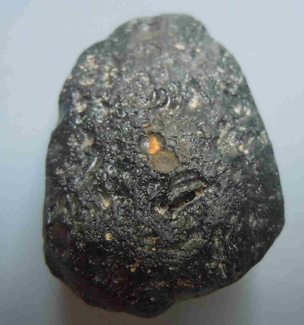 PHILIPPINITE TEKTITE - FROM METEORITE IMPACT: Title: PHILIPPINITE TEKTITE - FROM METEORITE IMPACT Origin: Paracale, Camarines Norte, Luzon, Philippines Size: 2.5x2x1 cm / 8 gram triangular rizalite/philippinite tektite with fine ornamentation Res