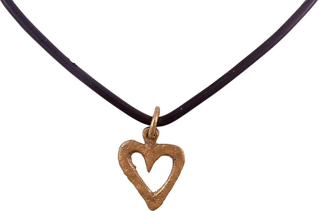 VIKING HEART PENDANT C.950-1050 AD JEWELRY: Just under 3/4" height. The Viking heart in its fully developed form with full cusp top. Broad border and pierced open center. A heart within a heart! Thick, relatively flat section, produced by the o