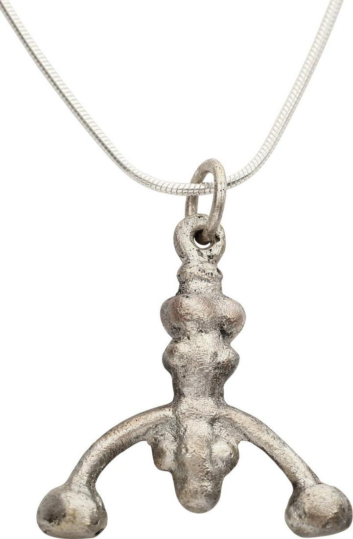 VIKING LUNAR PENDANT NECKLACE, 9th-10th CENT: Silvered bronze. As expert navigators, the constellations signified mystery and power to Vikings. Lunar pendants were worn as pectorals as well as suspended from belts, other clothing and horse harnes