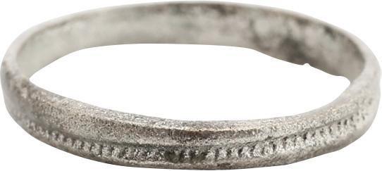 VIKING WOMAN’S WEDDING RING, SIZE 4 ¼: 10th-11th Century AD. The band with raised rounded edges flanking a central stippled medial. 2.3mm lightly textured from burial. Size 4 1/4 for the small finger as was the custom in some regions. Prof