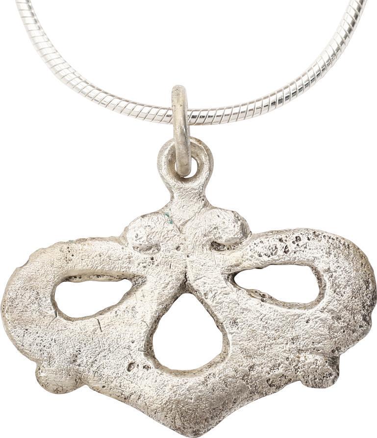 VIKING HEART PENDANT NECKLACE, 10TH-11TH CENTURY AD: Rare variation. Silvered bronze, 1” width comprised of foliate members forming in three opened or pierced lobes. The terminals supporting the suspension loop. For Vikings the heart stood for bravery
