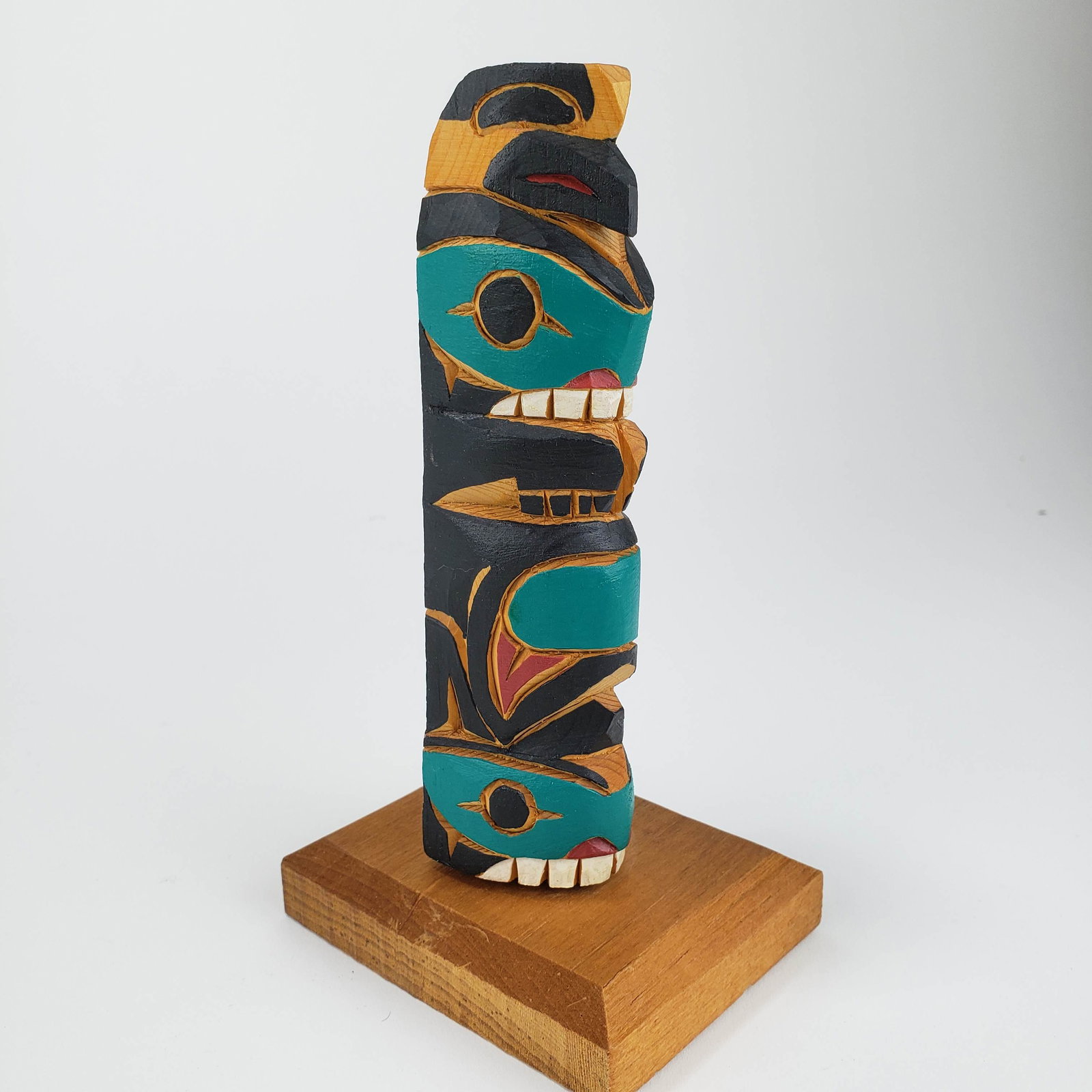 Northwest Coast Haida or Tlingit Souvenir Totem, signed: Title: Northwest Coast Haida or Tlingit Souvenir Totem, signed Date/Period: 20th century Materials: wood Dimension: 6 1/2" Additional Information: small Alaska souvenir totem, signed Shipping: Domesti