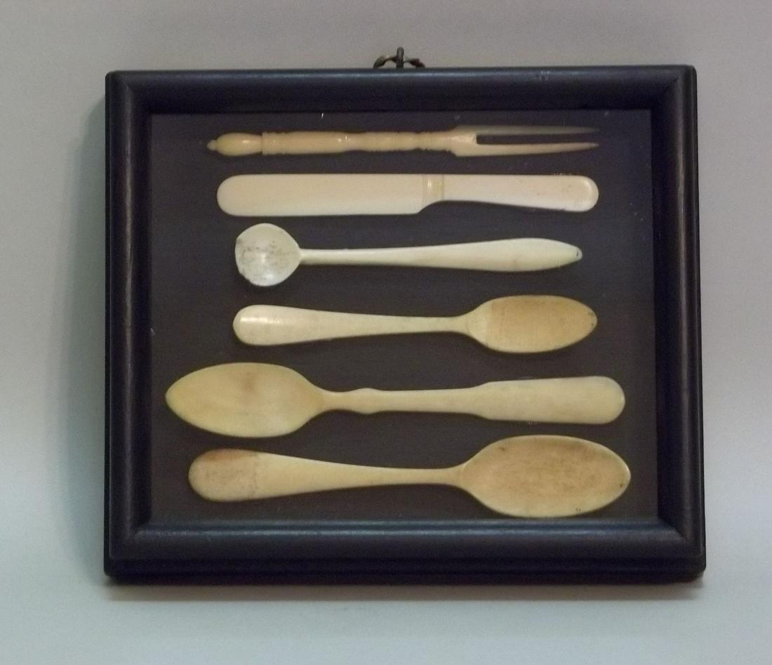 Diorama of Bone Utensils: Title: Diorama of Bone Utensils Date/Period: 19th c/ Origin: American Dimension: Diorama is 5 1/2" x 6 1/2" x 1 3/8” deep. Knife is 4 1/4” long; fork is 4 ½” long. Spoons range from 4” to 5��
