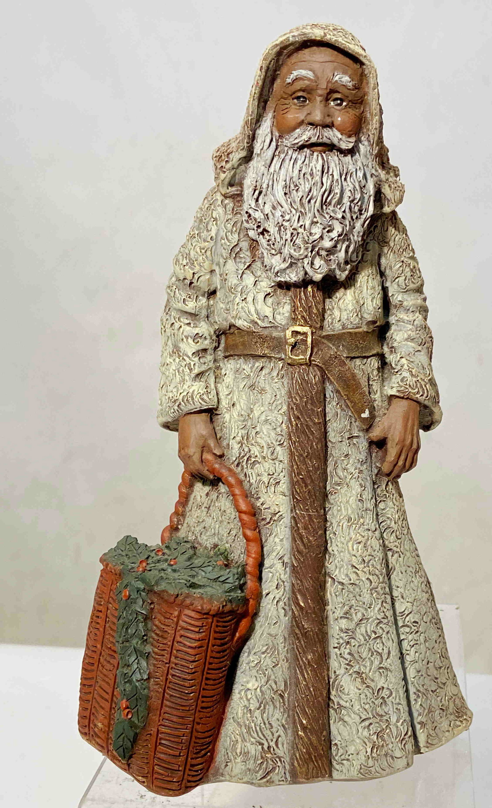 Ceramic Santa: Title: Ceramic Santa Dimension: 7 ¾” tall Additional Information: A Black ceramic Santa in gray robe with gold highlights. Shipping: Domestic: Flat-rate of $15.00 to anywhere within the contiguous 