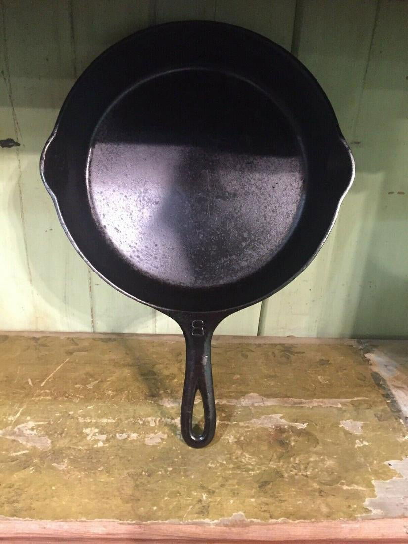 Large Logo Griswold Cast Iron Skillet #8 Erie Pa.: Title: Large Logo Griswold Cast Iron Skillet #8 Erie Pa. U.s.a. 704p Date/Period: Approx 1920-1939 Materials: Cast iron Dimension: Approx 15 x 11.25" Additional Information: It reads on the bottom cas