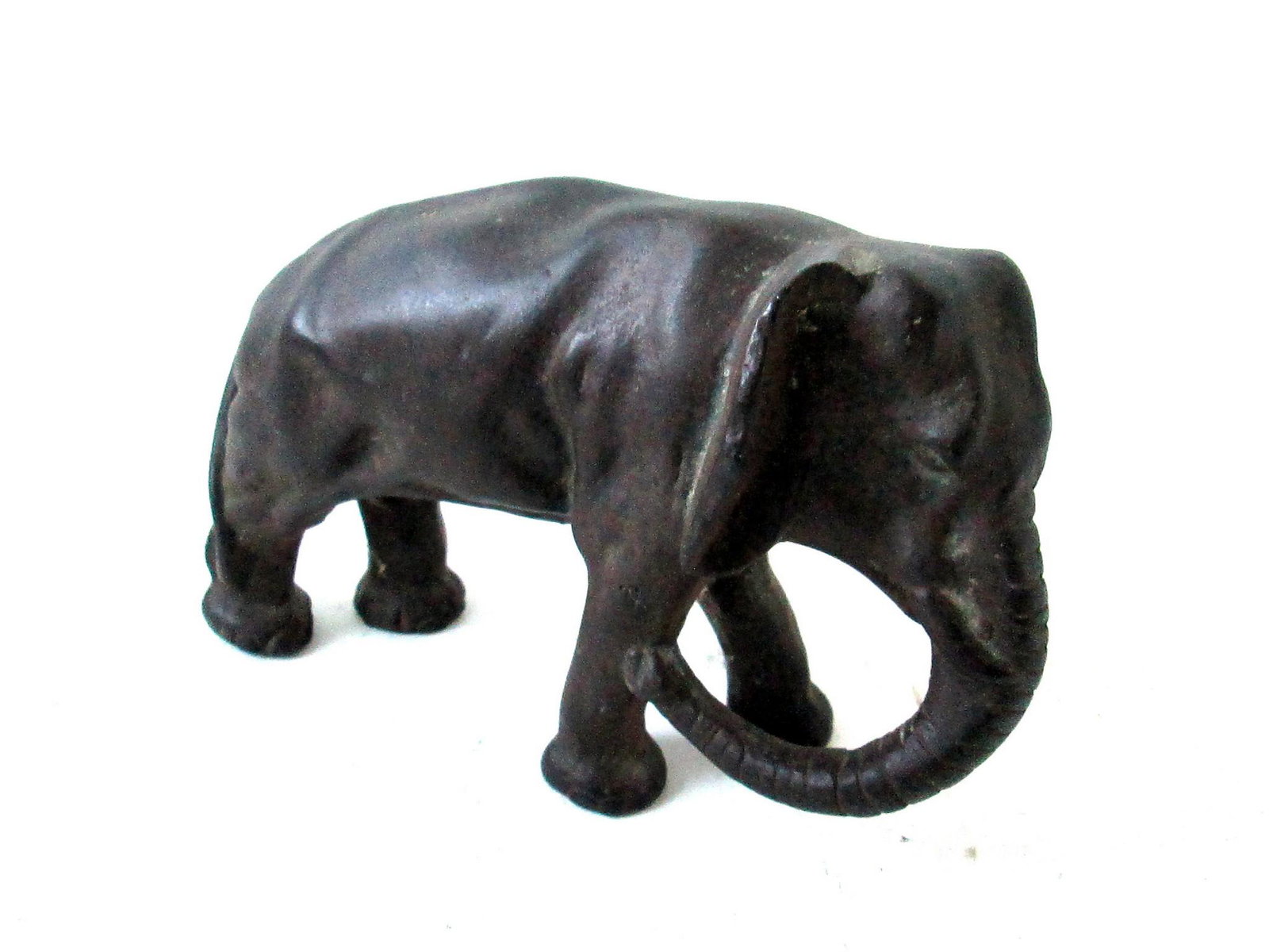 Great Elephant Doorstop: Title: Great Elephant Doorstop Date/Period: C 1920 Material: Cast Iron Dimension: 5 1/4”H X 8 1/2”W X 3 1/4”D Provenance/Additional Info: Superb casting details, full bodied, original bronzed su