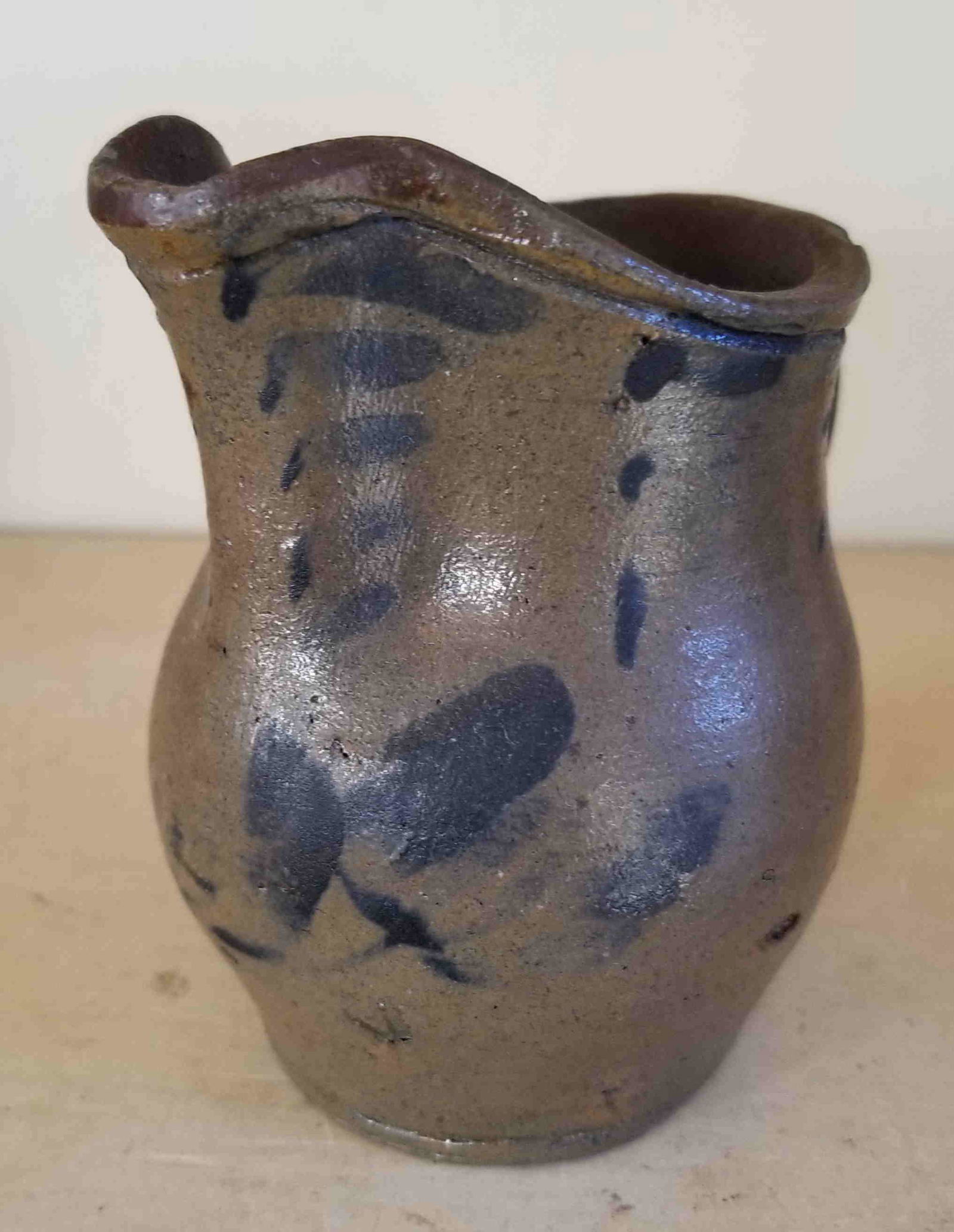 Tiny decorated stoneware pitcher, fresh to the market. (1 of 3)