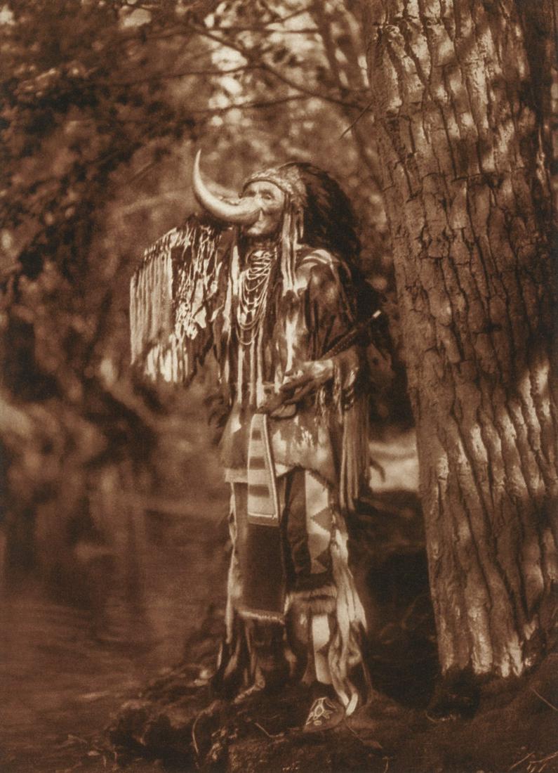 EDWARD CURTIS - Flathead Warrior, 1911: Artist: EDWARD CURTIS Title: Flathead Warrior, 1911 Medium: Tri-Color Photo Litho, 2004, Italy Dimensions: 7.2x9.95" Description: Heat Wax Mounted on 11x14" Conservation Board Artist Bio: Edward Sheri