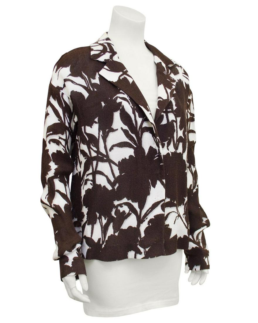 Prada Brown and Cream Floral Linen Jacket: Title: Prada Brown and Cream Floral Linen Jacket Additional Information: 1990's Prada linen relaxed fit jacket. All over floral print in contrasting chocolate brown and cream. Notched collar, dropped 