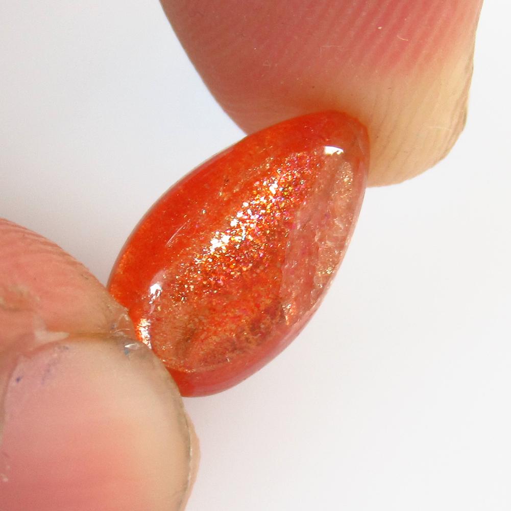 3.40 Ctw Natural Orange Sunstone Pear Cab: No Reserve! Title: 3.40 Ctw Natural Orange Sunstone Pear Cab Stone Clarity: Opaque Gemstones: Sunstone Size/Dimensions: 3.4 Carat Weights: 13.80 x 7.90 x 4.40 mm Additional Information: Excellent Pear