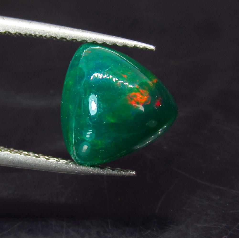 2.59 Ctw Natural Ethiopian Green Fire Opal Trillion Cab: No Reserve! Title: 2.59 Ctw Natural Ethiopian Green Fire Opal Trillion Cab Stone Clarity: Translucent Gemstones: Black Opal Size/Dimensions: 2.59 Carat Weights: 10.00 x 10.00 x 5.80 mm Additional Info