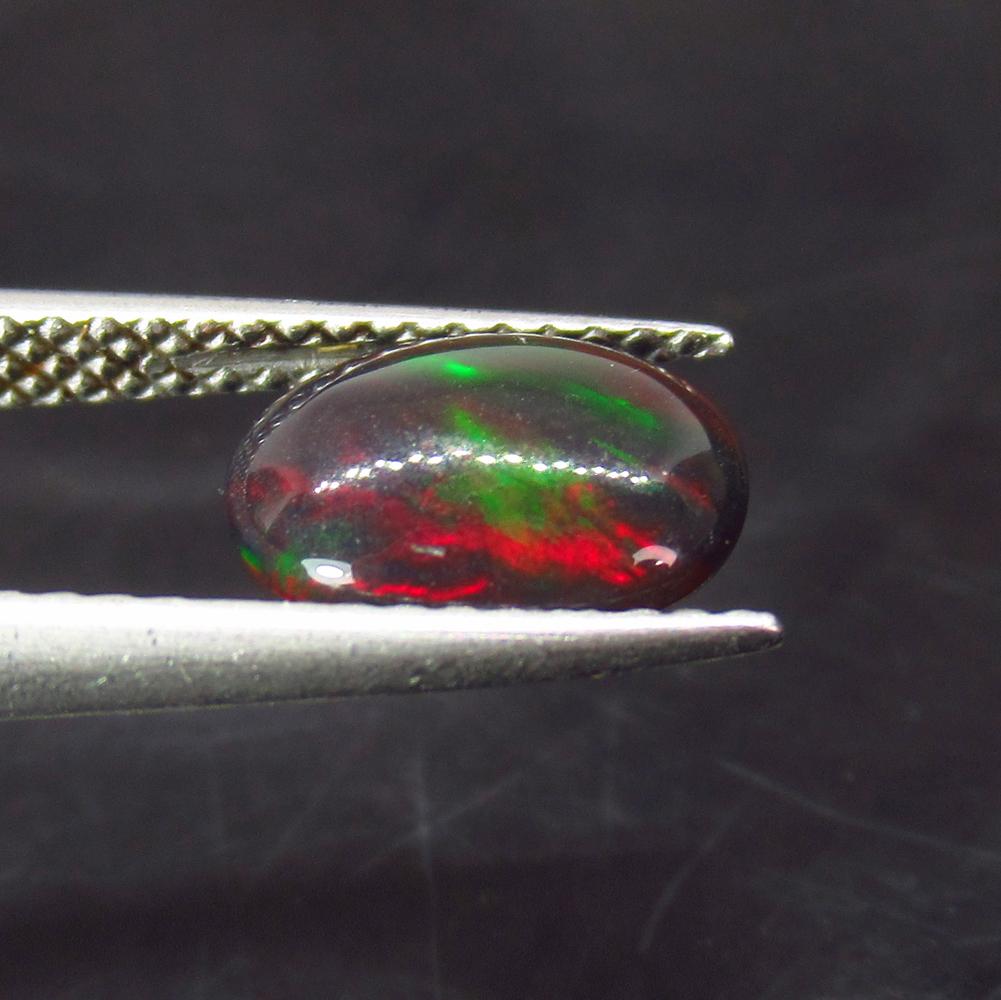 1.02 Ctw Natural Ethiopian Black Fire Opal Oval Cab: No Reserve! Title: 1.02 Ctw Natural Ethiopian Black Fire Opal Oval Cab Stone Clarity: Translucent Gemstones: Black Opal Size/Dimensions: 1.02 Carat Weights: 9.20 x 7.00 x 3.20 mm Additional Informatio