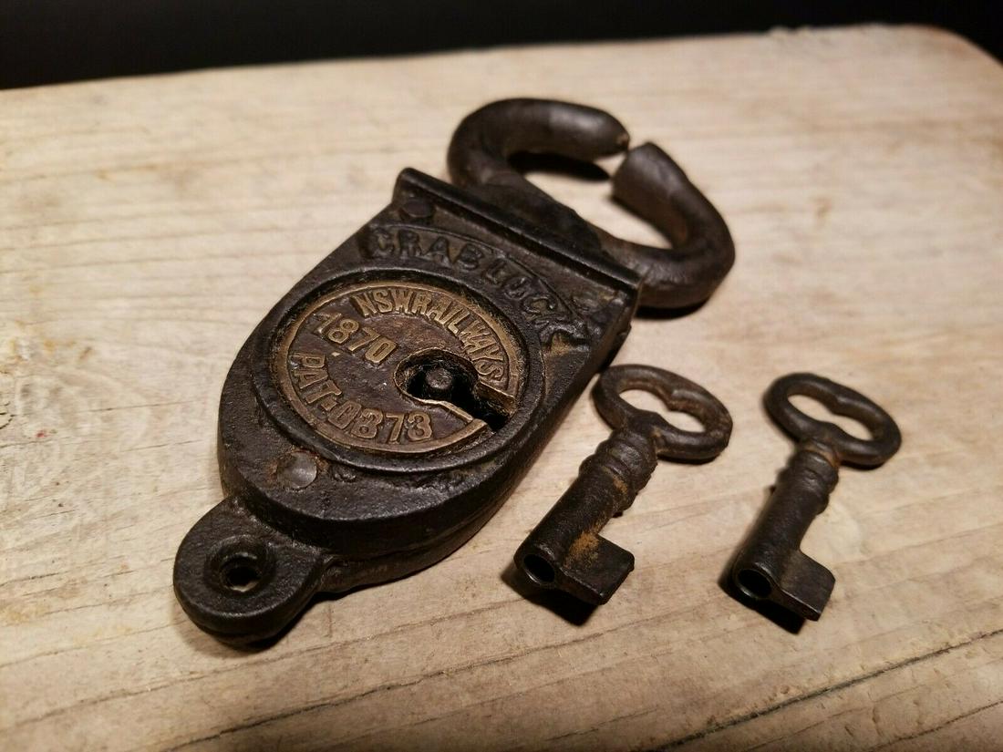 Wrought Iron Trunk Chest Box Crab Lock Key Padlock: 4 3/4" Long x 2 1/4" Wide Just wonderful heavy duty antique reproduction iron padlock with keys. Fully functional, looks great on an old truck or chest! Reserve: $20.00 Shipping: Domestic: Flat-rate o
