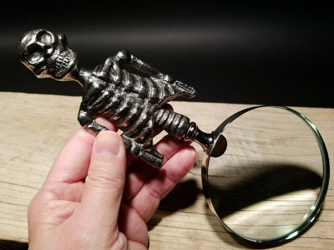 Skeleton Magnifying Glass Desk Hand Lens: 9 1/2" Long x 4" Wide Such a neat reproduction antique skeleton magnifying glass. The skeleton handle is all metal and aged to look old. The magnifying glass functions as it should. Makes a great acce