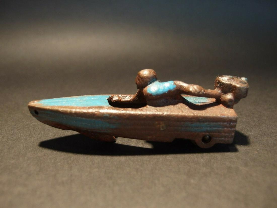 Mini Cast Iron Boat Racer Pull Toy: 4" Long 1 1/2" Tall 1 1/8" Wide Great little reproduction cast iron pull toy. All cast iron hand painted, slightly distress as shown in the images. Certainly looks old! Limited availability! Reserve: