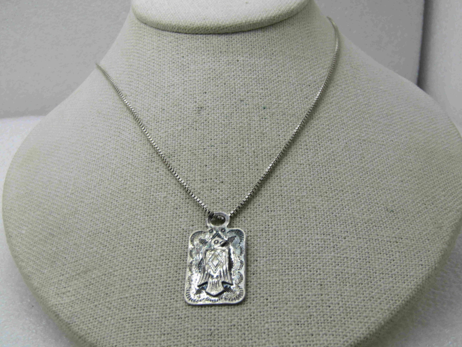 Vintage Southwestern Sterling Thunderbird Necklace, 19": Vintage Southwestern Sterling Thunderbird Necklace, 19" Box Chain, Signed KC.1.5mm wide chain, marked .925 and tested and Italy, signed KC. The pendant is a flat pendant with a thunderbird or payote b