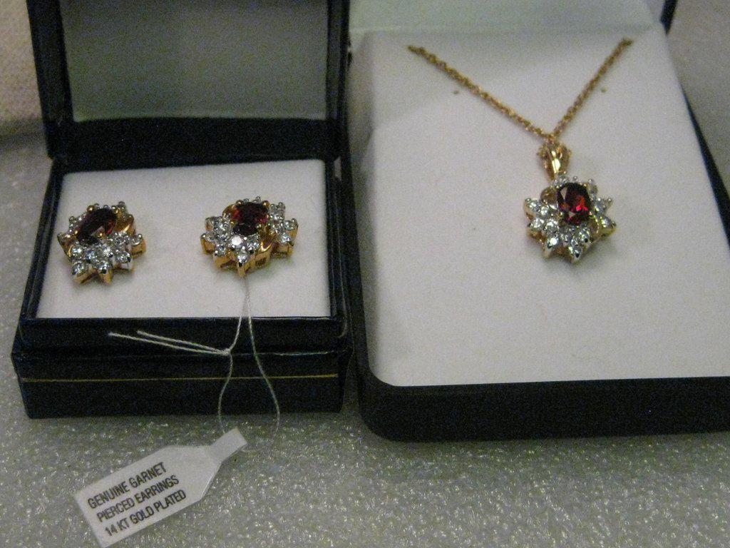 Genuine Garnet & Cluster CZ Necklace & Pierced Earring: Genuine Garnet Necklace & Pierced Earring Set - 18" 14kt G.F. necklace with a pendant that has a center oval cut garnet with cz in a pointed setting tiered creating a very rich look in this pendant th