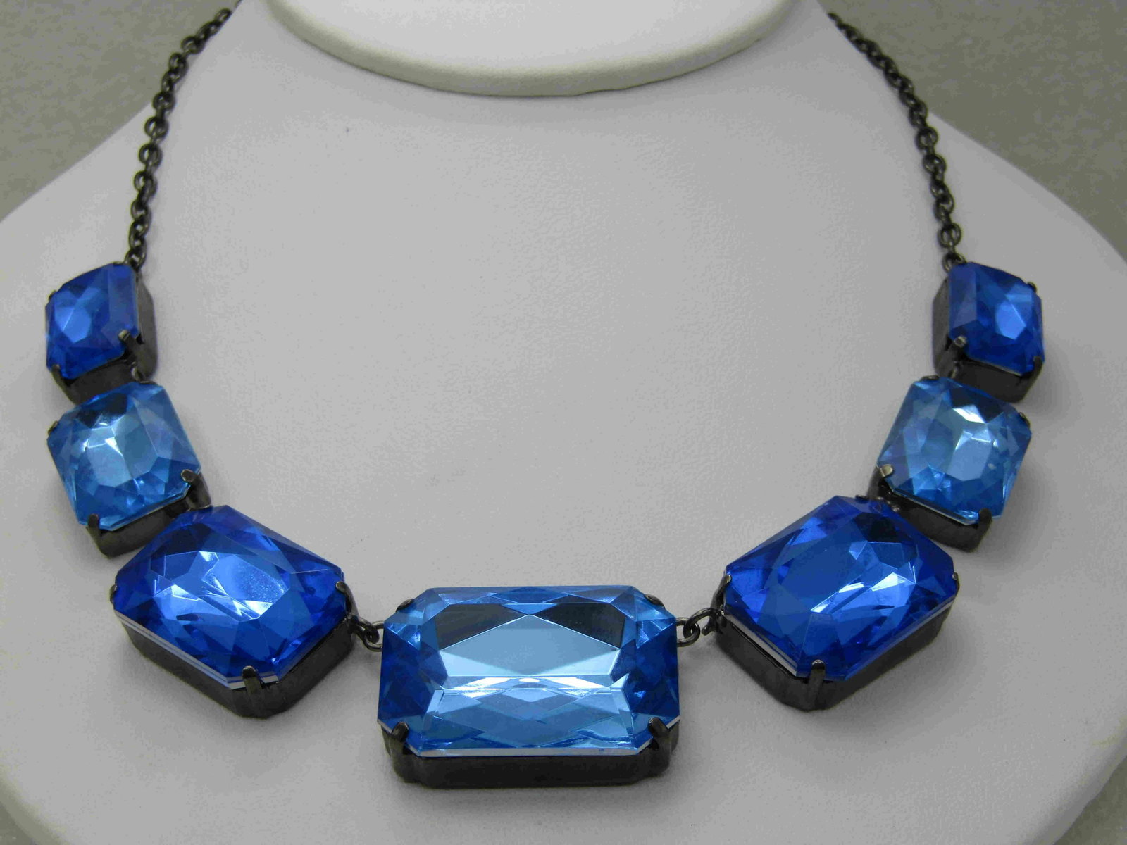 Vintage Blue Rhinestone Choker Necklace, 17", Graduated: Vintage Blue Rhinestone Choker Necklace, 17", Graduated Stones, acrylic alternating dark and ligher aqua blue rectangular stones that range from 18mm by 12.8mm at the ends to 31.5mm to 22.5mm at cente