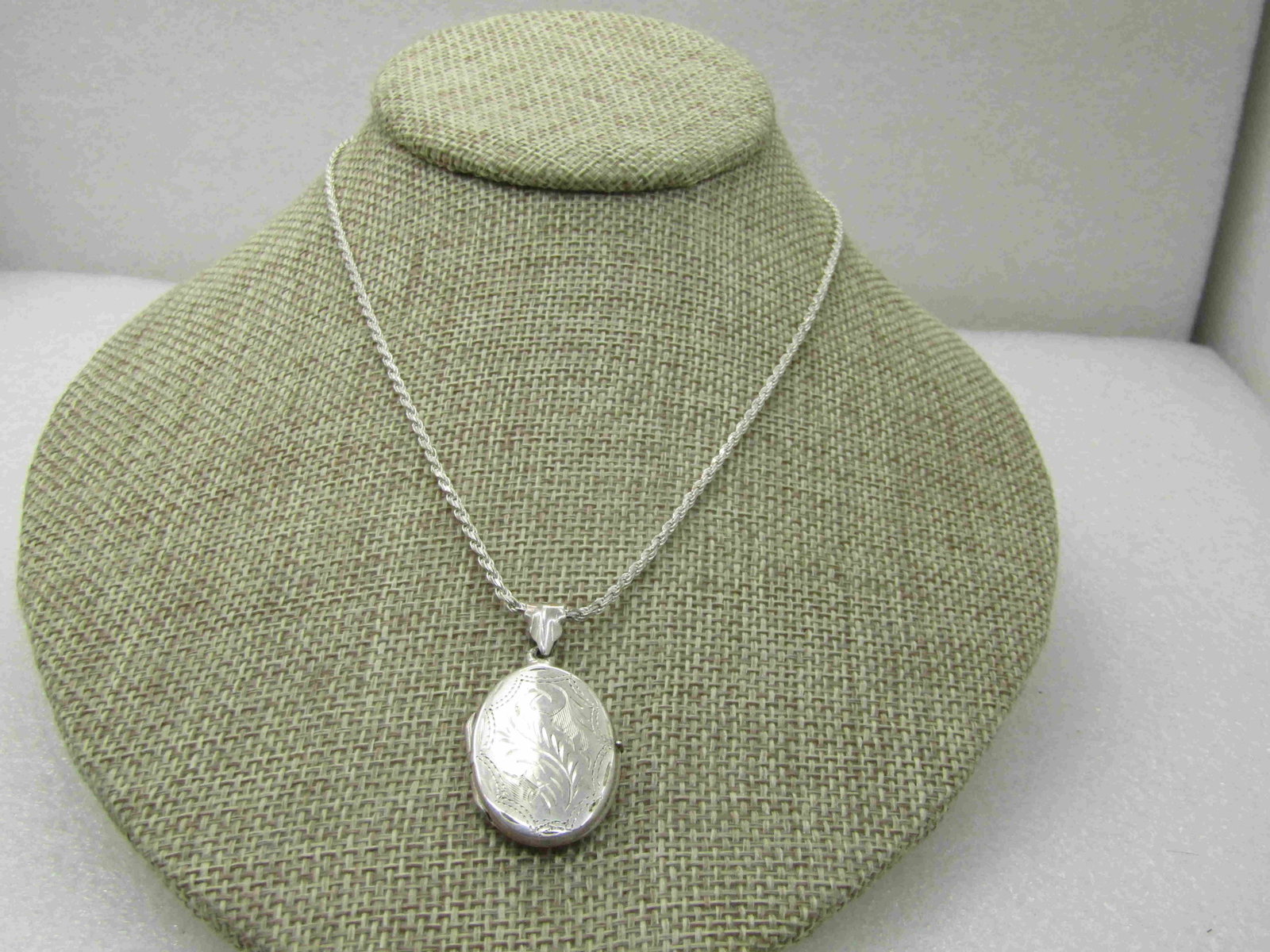 Vintage I.B.B. Sterling Silver Locket Necklace, 15",: Vintage I.B.B. Sterling Silver Locket Necklace, 15", 10.35 Gr. Signed Italy and IBB on clasp area. Locket marked .925. Locket has a wide swing bail, decorative, with the hinged locked with engraved sc
