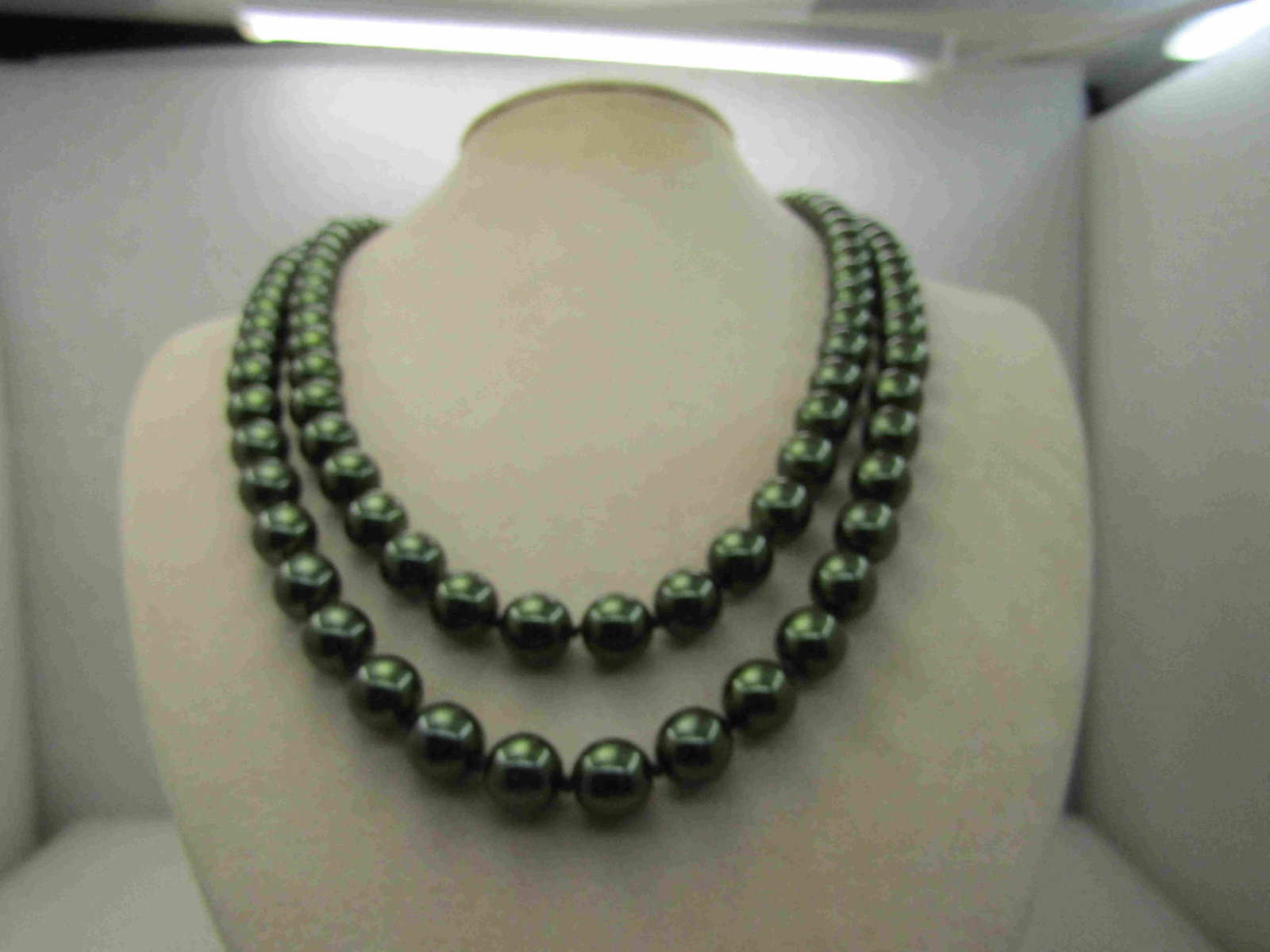 Vintage Joan Rivers Green Tahitian Pearl Necklace, Snap: Vintage Joan Rivers Green Tahitian Pearl Necklace, Snap Clasp, 22" , double strand. Ornate gold tone leaf swag snap clasp. The Tahinitian-like Pearls are deep green, knotted between and are likely a g