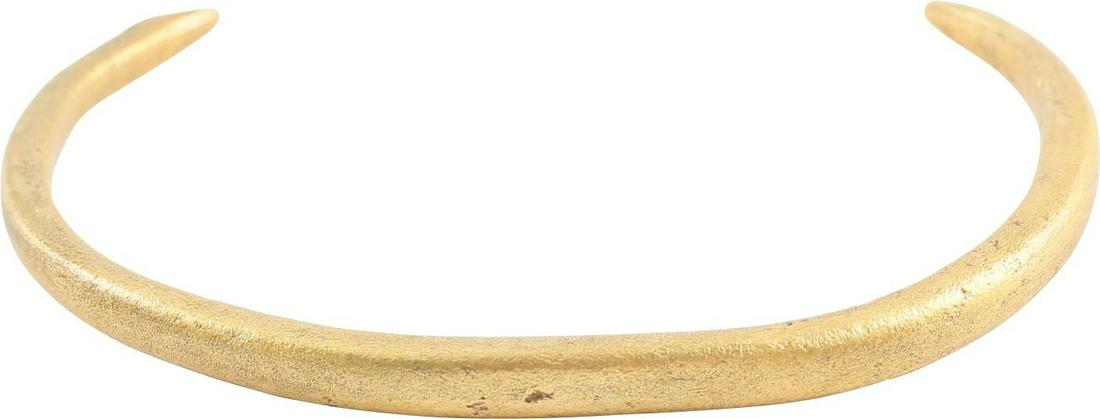 FINE VIKING WOMAN’S BRACELET C.900-1050 AD: 2 3/8" inside dimension which snugly fits a 175# man. C form, tapered from its center to the ends, each of which is shaped like a stylized bird head. Professionally refurbished with the 24k gold overl