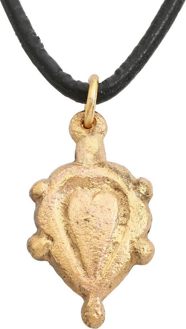 FINE VIKING HEART NECKLACE PENDANT, 10TH C.AD: 3/4” height plus the loop. 10th-11th Century AD. Fine full hears, high relief with cusped top. Broad rounded surround. The sixth point with small nubs. Made by the open face mold process. The heart 