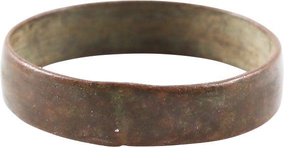 VIKING WEDDING RING C.850-1050 AD SIZE 8 ¼: Size 8 1/4. 4.3mm width with low rounded face. Made of copper without the benefit of alloying. Fine rich red copper patina. Vikings were expert metallurgists. The use of pure copper is rare and sugges