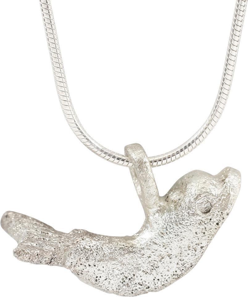 ANCIENT ROMAN DOLPHIN PENDANT NECKLACE C.100-300 AD: Slightly under 1” length. Classic depiction with an arched body, and fantail. Representing the striped or bottlenose dolphins which are common in the Mediterranean. Dolphins were both revered and fe