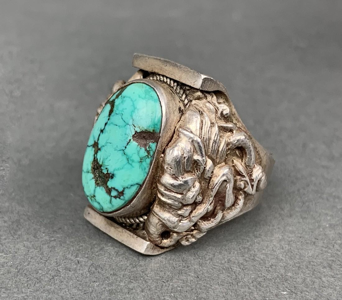 Tibet Silver Tourq Saddle Ring: Title: Tibet Silver Tourq Saddle Ring i extremely fine silver work with carved dragons on either side Date/Period: 20th c. Size: size 10 (16.5 grams) Reserve: $175.00 Shipping: Domestic: Flat-rate of