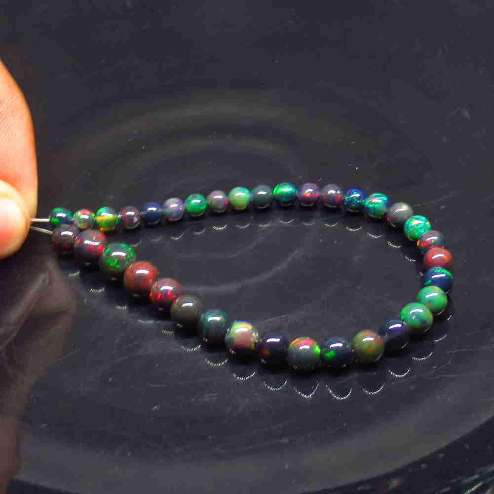 21.27 Ct Natural 35 Drilled Black Fire Opal Ball Beads (1 of 2)