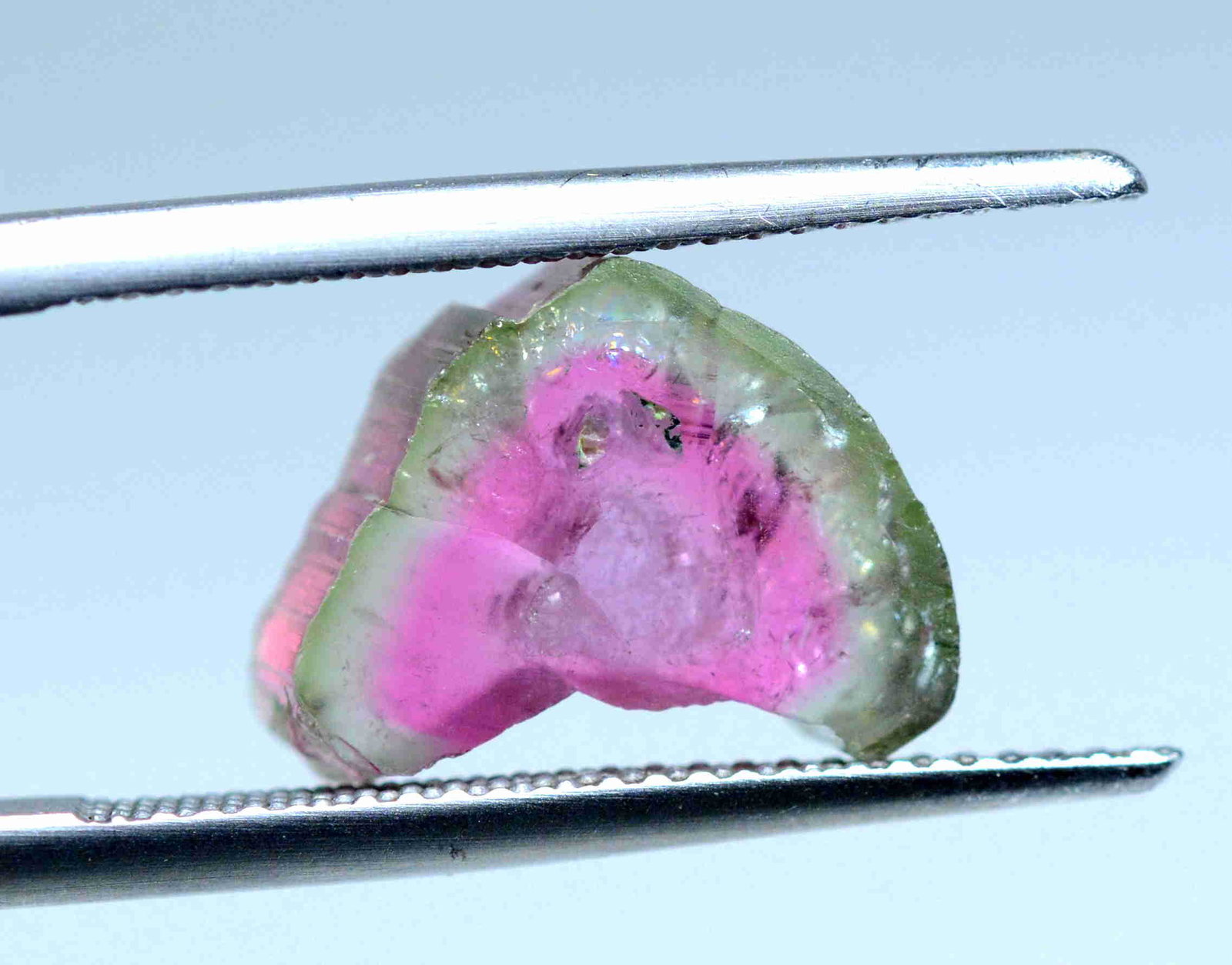 4.35 CTs Superb Watermelon Tourmaline Slice: Title:4.35 CTs Superb Watermelon Tourmaline Slice Weight: 4.35 cts Size/Dimensions: 12x9x4 mm Origin: Pakistan Reserve: $25.00 Shipping: Domestic: Flat-rate of $18.00 to anywhere within the contiguous