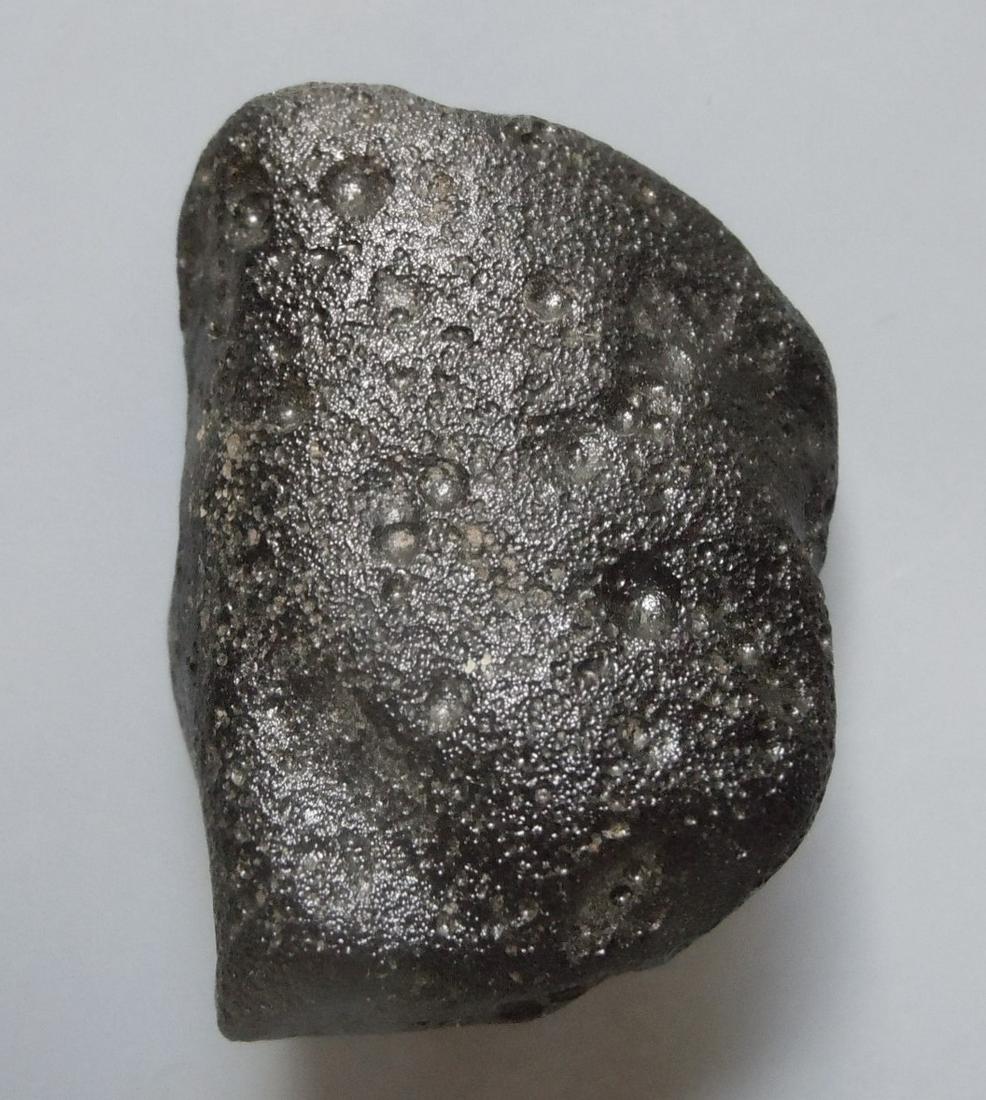 PHILIPPINITE TEKTITE - FROM METEORITE IMPACT: Title: PHILIPPINITE TEKTITE - FROM METEORITE IMPACT Origin: Paracale, Camarines Norte, Luzon, Philippines Size: 3x2x1.5 cm / 15 gram smooth & rounded rizalite/philippinite tektite with some sculpture