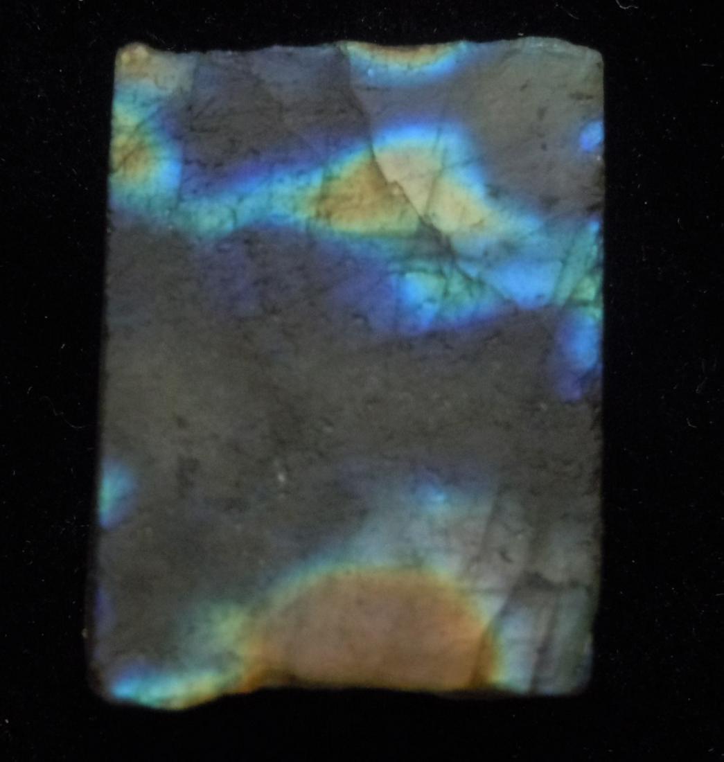 51.75 IRIDESCENT LABRADORITE: Title: 51.75 IRIDESCENT LABRADORITE Origin: Ampanihy, Atsimo-Andrefana, Madagascar Size: 2.5x2x0.7 cm/ 10.35 gram iridescent, multicolor and translucent labradorite Reserve: $3.00 Shipping: Domestic: