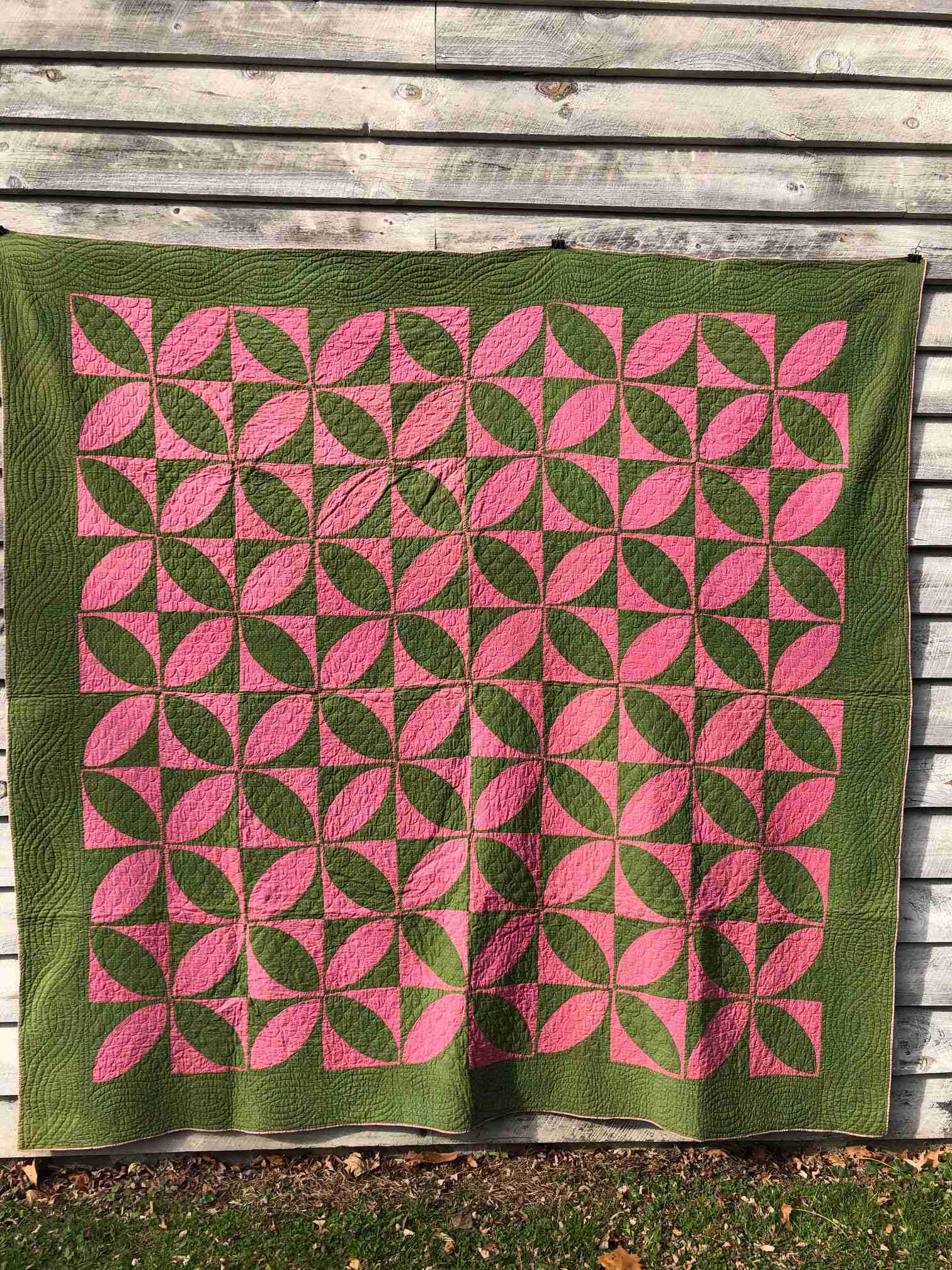 Antique quilt with variation of a pinwheel pattern (1 of 4)