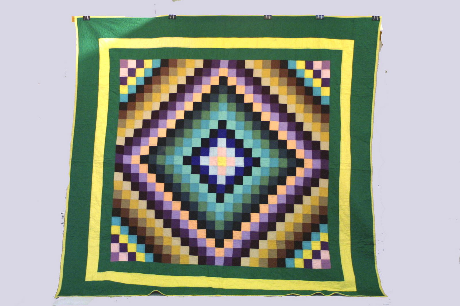 An early 20th century Ohio mennonite quilt in the: Title: An early 20th century Ohio mennonite quilt in the sunshine and shadow pattern Provenance: c. 1910 - Size: 79" x 78" . Shipping: Domestic: Shipping rates are determined by destination.. Combined