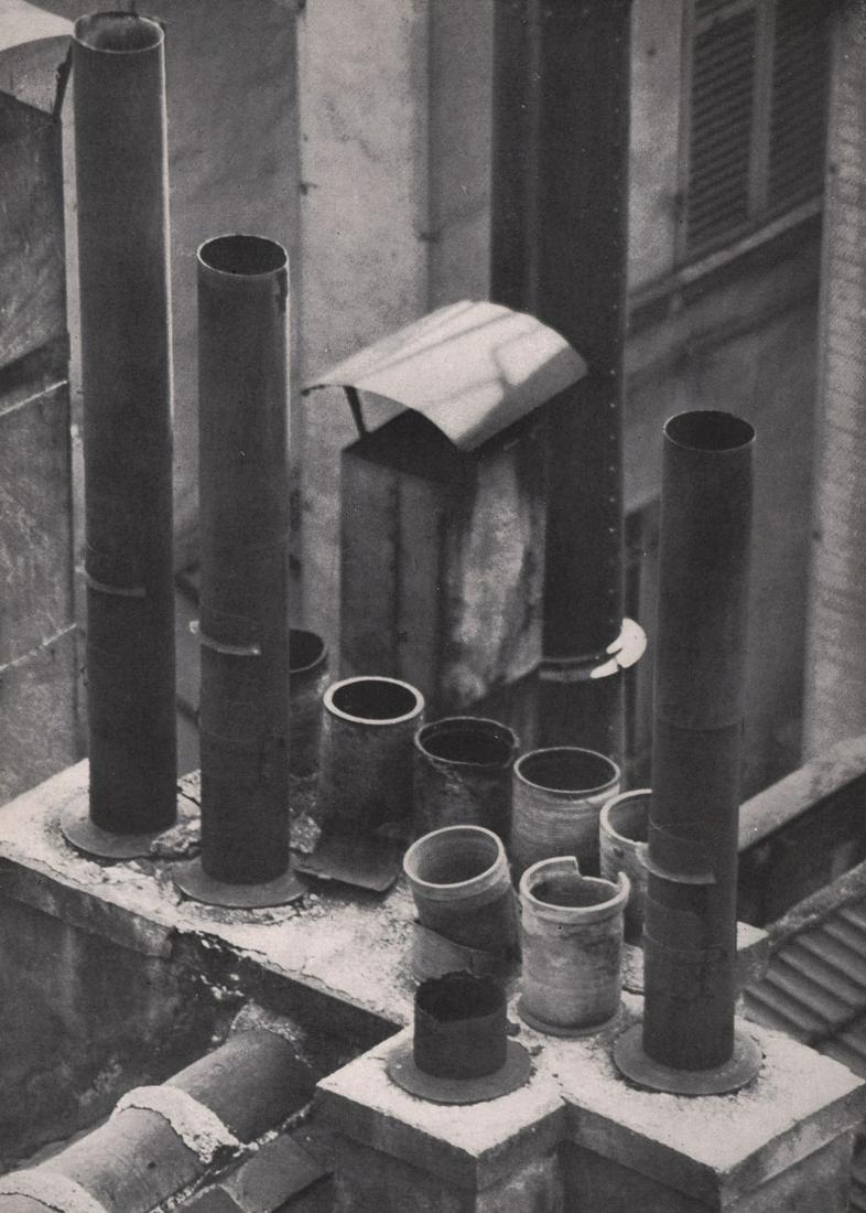 KERTESZ - Montparnasse, Old Chimneys: Artist: KERTESZ Print Title: Montparnasse, Old Chimneys Medium: Photoengraving Printed 1940’s in the USA Image size (inches) approx. 9 x 6.5” Andre Kertesz (1894-1985) born Kertesz Andor, was a