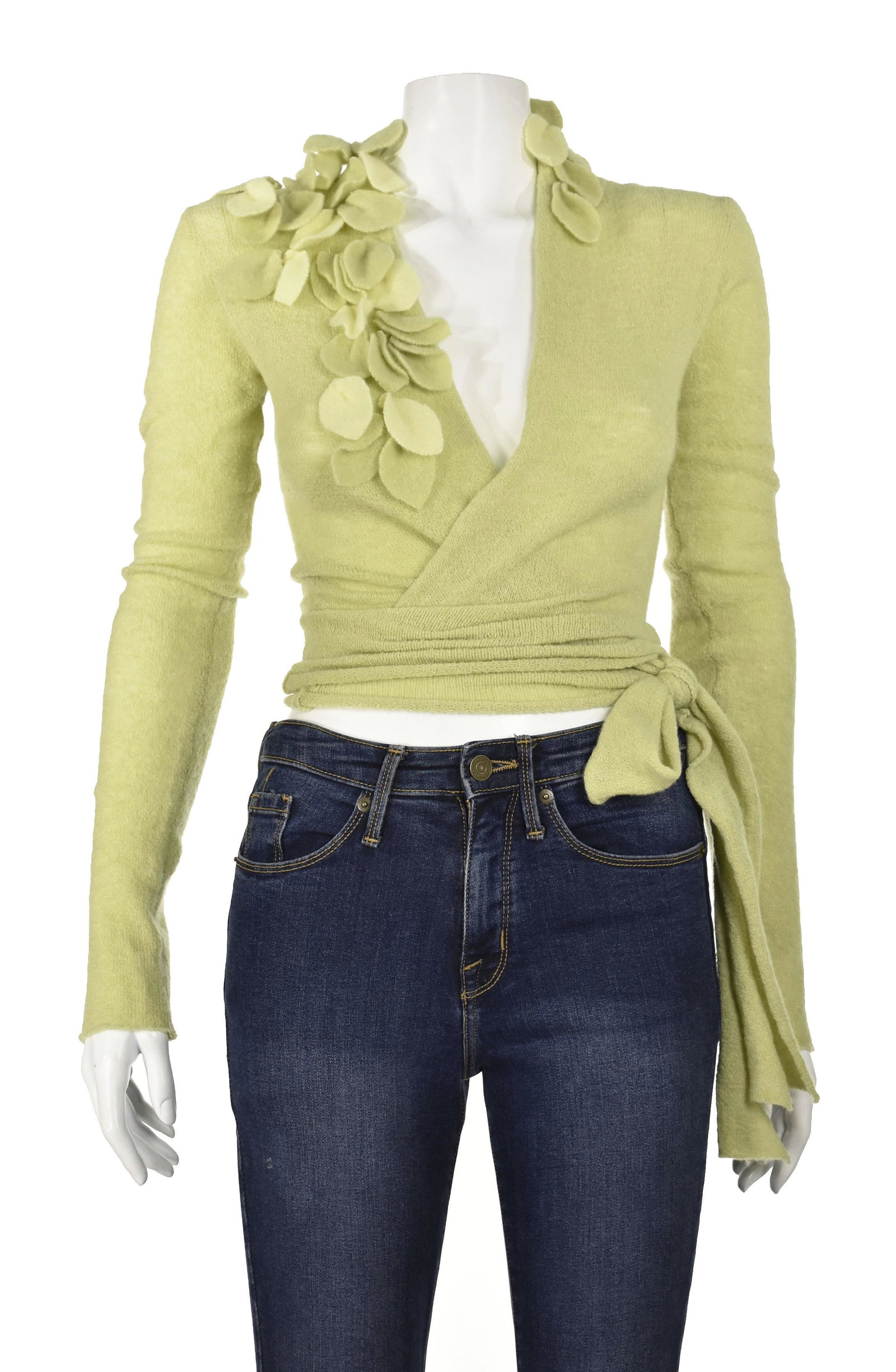 CASMARI Lime Green Cashmere Wrap Sweater: Pale lime green cashmere sweater from Casmari is whisper soft and light as a cloud. It features a wrap waist and a cascade of laser cut leaves around the neckline. The sweater is pictured here tied ar