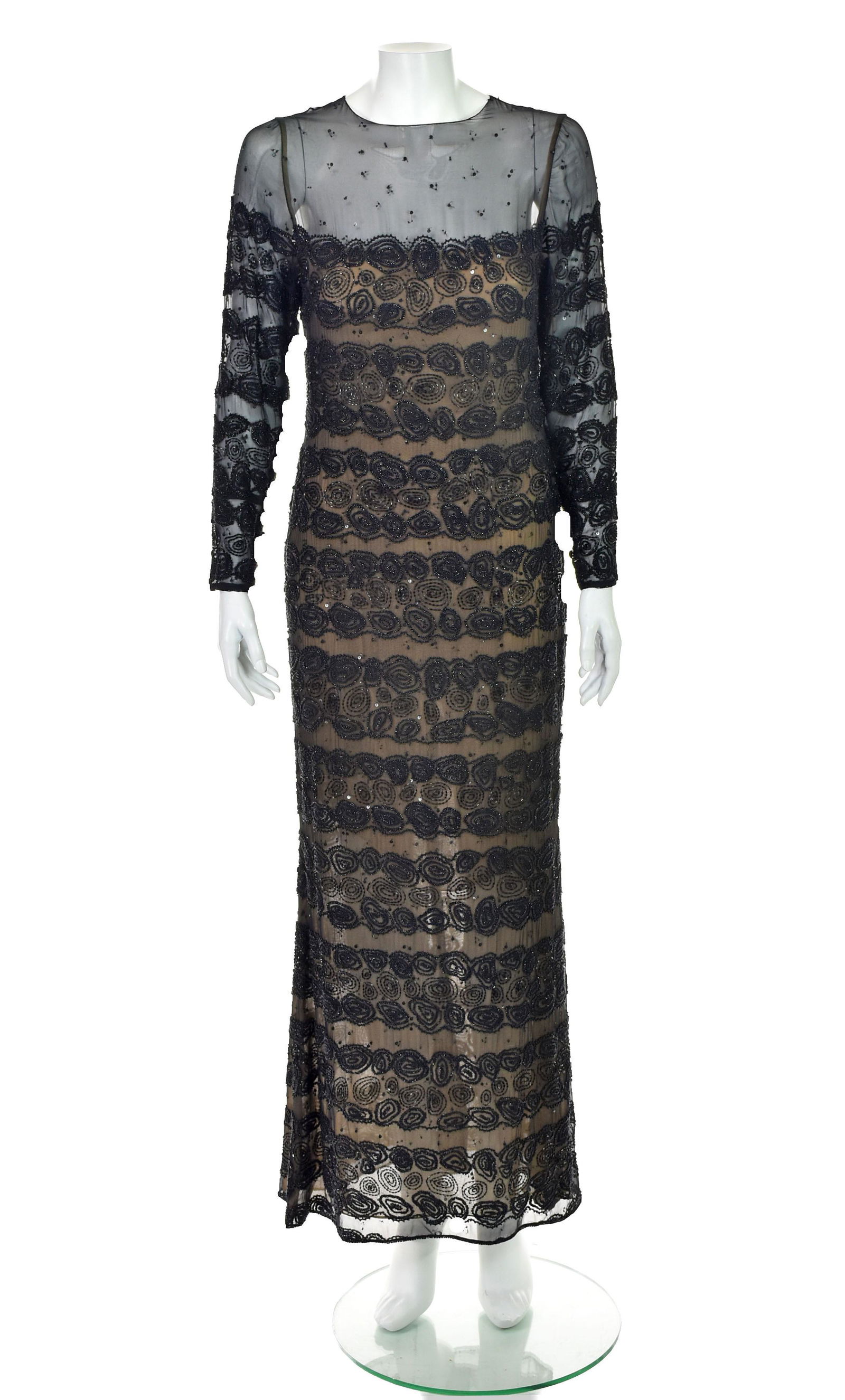BILL BLASS Vintage Black Beaded Evening Dress: Black silk chiffon vintage evening gown from Bill Blass is lightly sequined on the illusion bodice and heavily beaded throughout the rest of the dress. Long sleeves have elegant three-button closures