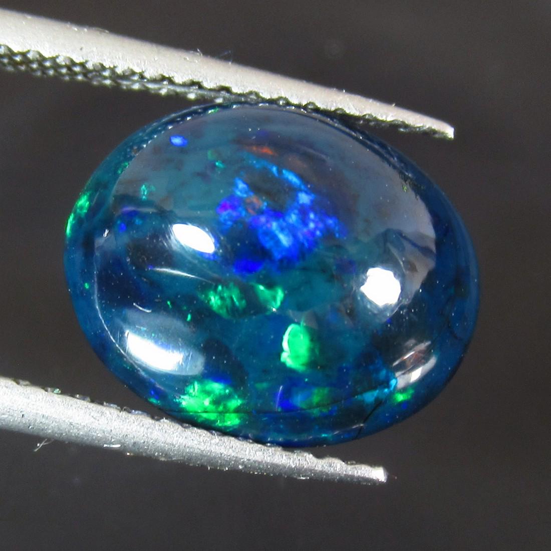 2.88 Ct Natural Ethiopian Black Fire Opal Oval Cab: No Reserve! Title: 2.88 Ct Natural Ethiopian Black Fire Opal Oval Cab Stone Clarity: Translucent Gemstones: Natural Black Opal Carat Weights: 2.88 Size/Dimensions: 12.00 x 10.00 x 5.30 mm Additional I