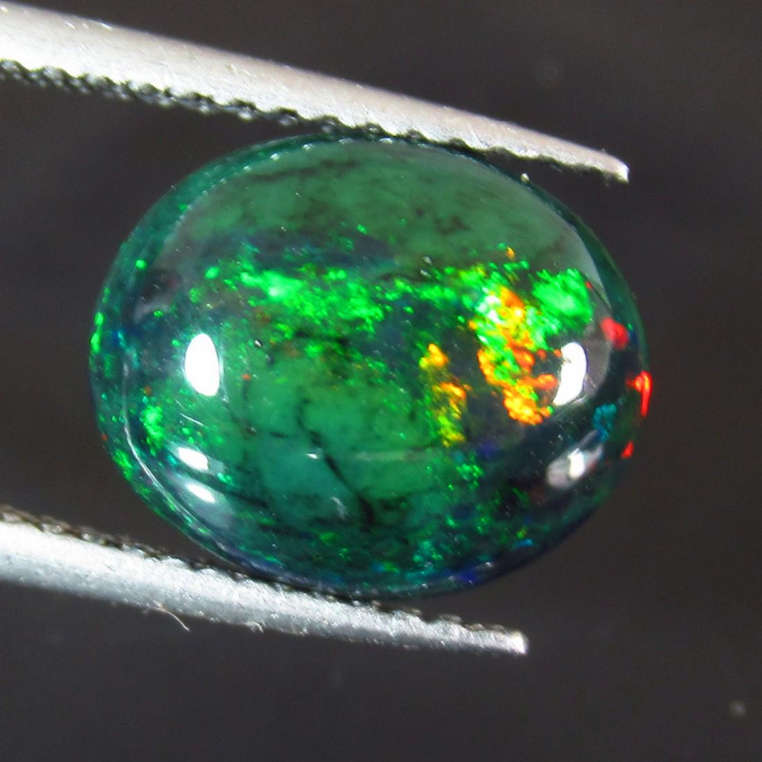 2.37 Ct Natural Ethiopian Black Fire Opal Oval Cab: No Reserve! Title: 2.37 Ct Natural Ethiopian Black Fire Opal Oval Cab Stone Clarity: Translucent Gemstones: Natural Black Opal Carat Weights: 2.37 Size/Dimensions: 11.50 x 9.50 x 4.80 mm Additional In
