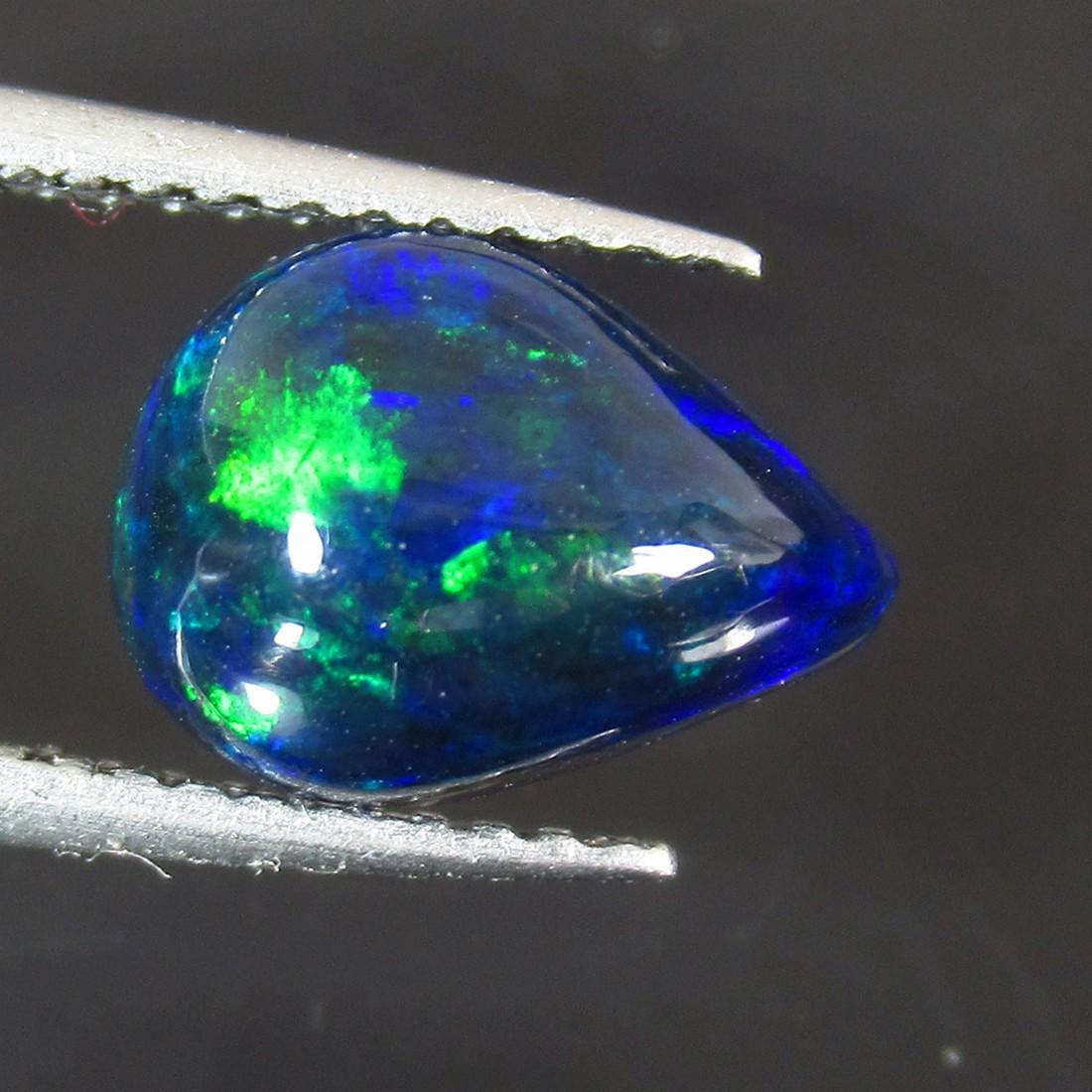 1.73 Ct Natural Ethiopian Black Fire Opal Pear Cab: No Reserve! Title: 1.73 Ct Natural Ethiopian Black Fire Opal Pear Cab Stone Clarity: Translucent Gemstones: Natural Black Opal Carat Weights: 1.73 Size/Dimensions: 10.50 x 7.80 x 5.10 mm Additional In