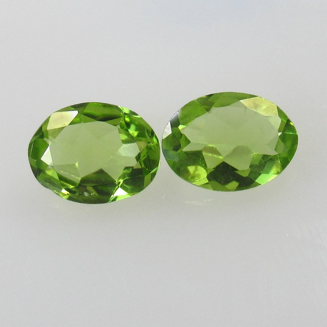 2.70 Ctw Natural Pakistan Peridot Oval Pair: No Reserve! Title: 2.70 Ctw Natural Pakistan Peridot Oval Pair Stone Clarity: VVS Gemstones: Peridot Size/Dimensions: 2.7 Carat Weights: 8.80 x 6.70 x 3.70 mm Additional Information: Top Class Full Lu