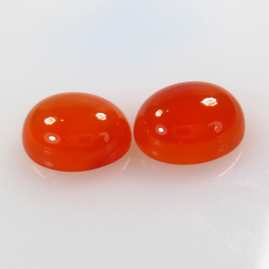 9.80 Ctw Natural Orange Carnelian Oval Pair: No Reserve! Title: 9.80 Ctw Natural Orange Carnelian Oval Pair Stone Clarity: Semi-Transparent Gemstones: Carnelian Size/Dimensions: 9.8 Carat Weights: 12.20 x 10.20 x 5.60 mm / 2 PC's Additional Info